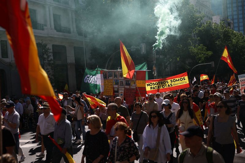 Tens of thousands march in Madrid to demand prime minister’s resignation