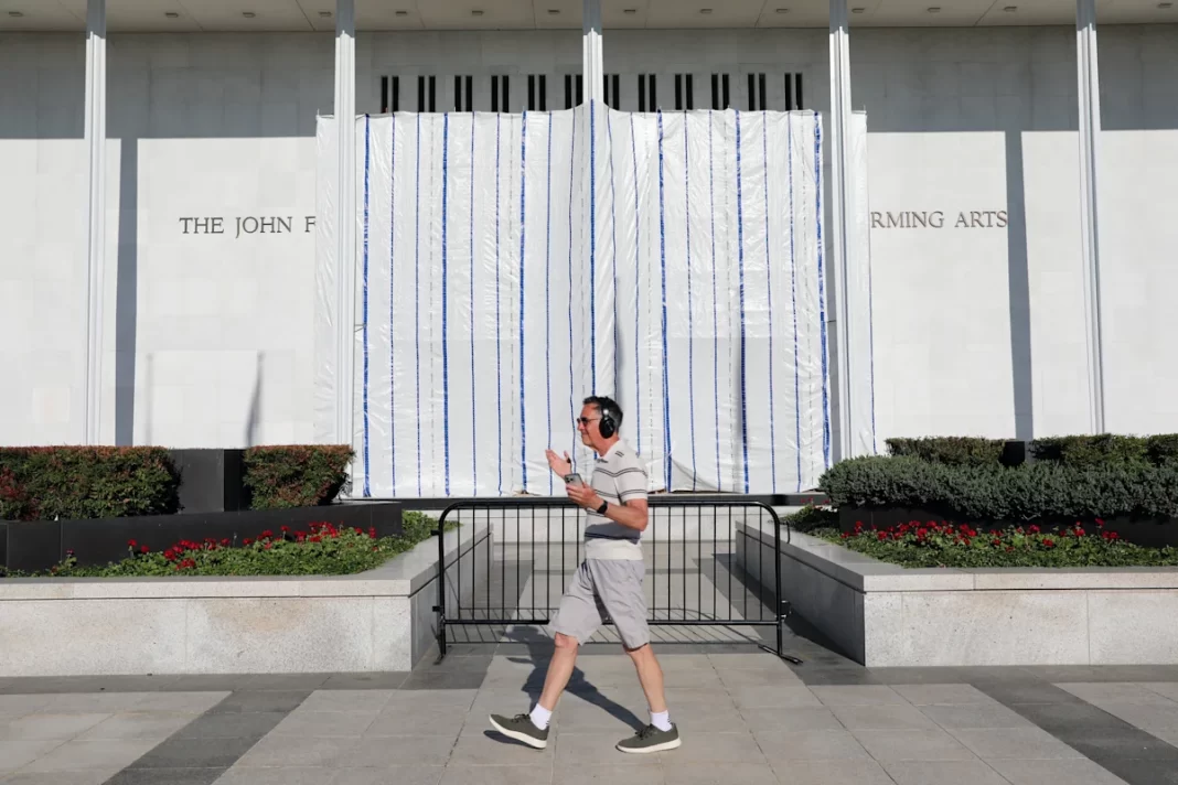 A tarp now covers where Trump’s name used to hang at the Kennedy Center