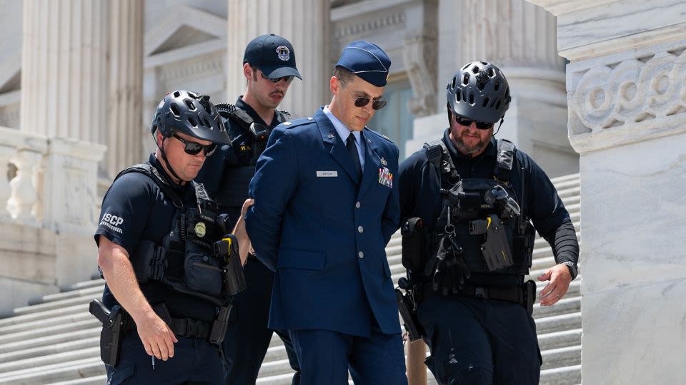 US airman arrested at Capitol after calling for Trump’s impeachment is detained again